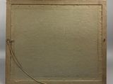 an old photo of a picture frame with a string attached to it