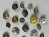 a lot of coins that are on a white surface