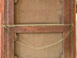 an old wooden box with a rope on top of it sitting on a table