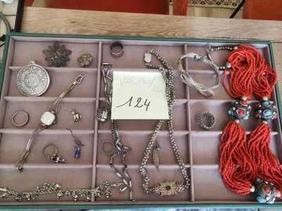 a box with a lot of jewelry in it