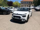 the white citrole is parked in a parking lot with other cars
