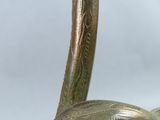 a close up of a metal sculpture of a snake