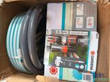a box with a bunch of hoses inside of it