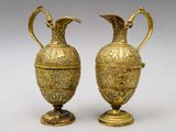 pair of antique brass vases with handles on pedestals