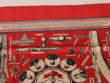 red scarf with guns, guns, and other items on it