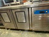 a kitchen with a bunch of stainless steel appliances in it