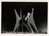 an old black and white photo of a sculpture in the middle of a field