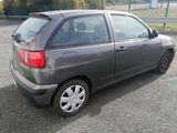 a gray car parked in a parking lot