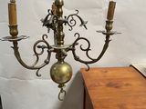 a light that is hanging from a chandelier in a room