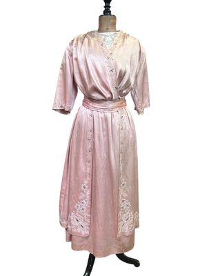 pink silk dress with white lace trim and sleeves