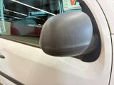 reflection of a car in the side mirror of a white car