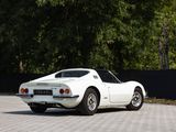 a white sports car that is parked in a parking lot