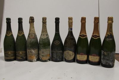 several bottles of champagne are lined up on a table