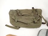 a bag that is sitting on a table next to a pair of shoes