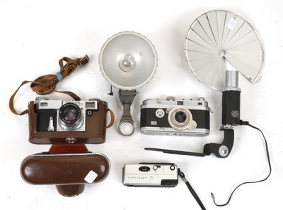 a lot of different types of cameras that are on the table