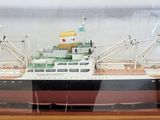 a model of a boat in a glass case