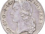 a close up of a coin with a woman ' s face on it