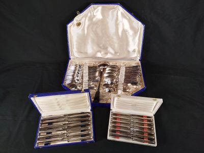 three silverware items are in a case on a black background