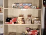 a book shelf with a lot of food on top of it