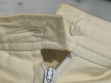 a close up of a zipper on a pair of pants