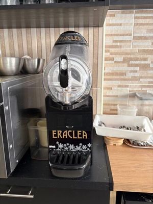 a machine that is sitting on a counter in a kitchen