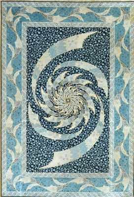 une couette bleue et blanche ornée d'un motif en spirale