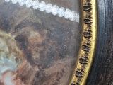 a picture of a woman with a pearl necklace in a picture frame