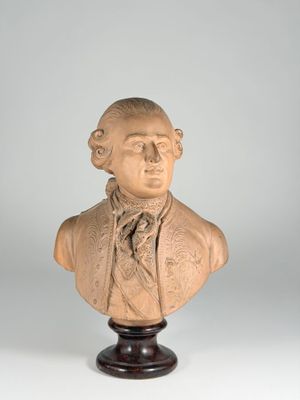a close up of a bust of a man wearing a tie