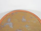 a round mirror that is sitting on a table