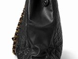 a black bag with a chain hanging from the handle