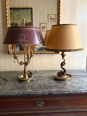two lamps that are on top of a dresser