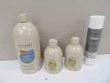 three bottles of lotion and a bottle of lotion on the counter