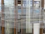 a picture of a pallet with a bunch of windows wrapped in plastic