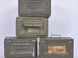three army green boxes are stacked on top of each other