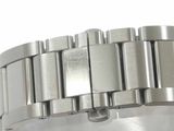 a close up of a watch on a white surface