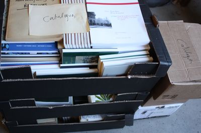 a box full of books sitting on top of a table