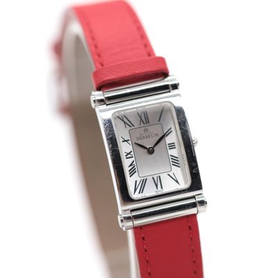 an image of a red strap watch with roman numerals