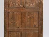 an old wooden door with a rope hanging from it ' s side