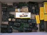 a box full of toy army vehicles and other items