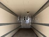 a long hallway with a lot of pipes in it
