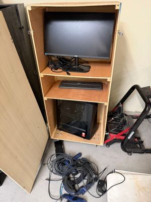 a small cabinet with a television on top of it