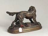 bronze statue of a dog and a cat on a wooden base
