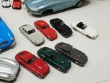 a lot of toy cars that are sitting on a table