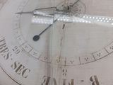 a large clock with roman numerals on it ' s face