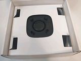 a white box with a black object inside of it