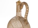 a glass bottle with a handle on a white background