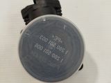 a close up of a water meter on a white surface