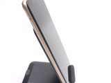 a cell phone that is sitting on a stand