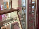 a glass display case with donuts inside of it