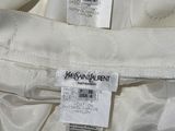 the label of a white jacket is on the back of the jacket